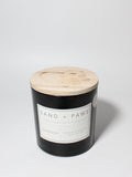 Sand + Paws Teakwood 21 oz scented candle Black vessel with Paw in Heart lid